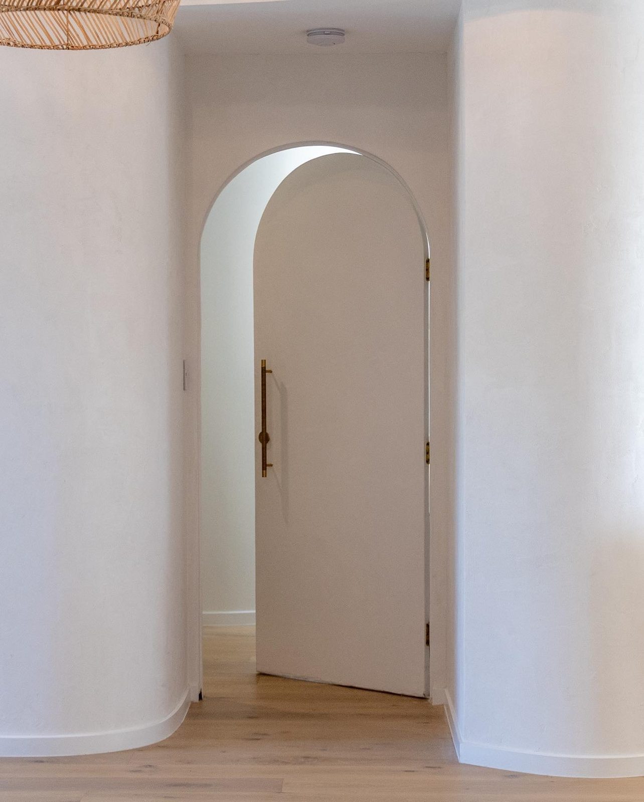 Arched entry in lime plaster